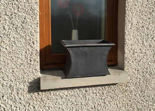 chunky industrial style curve sided lead planter