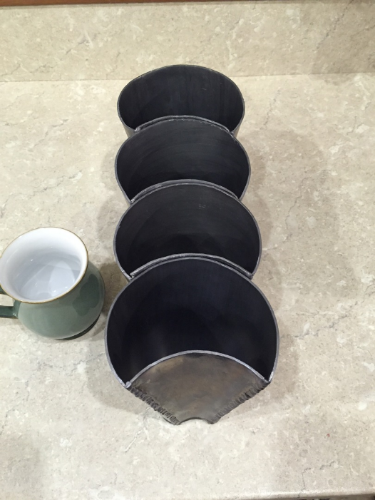 curvy lead plantpots all in a row